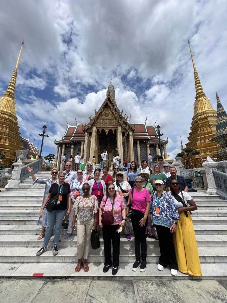 A photo of Go Ahead Tours solo travelers in front of Wat Phra Kaew in Bangkok.