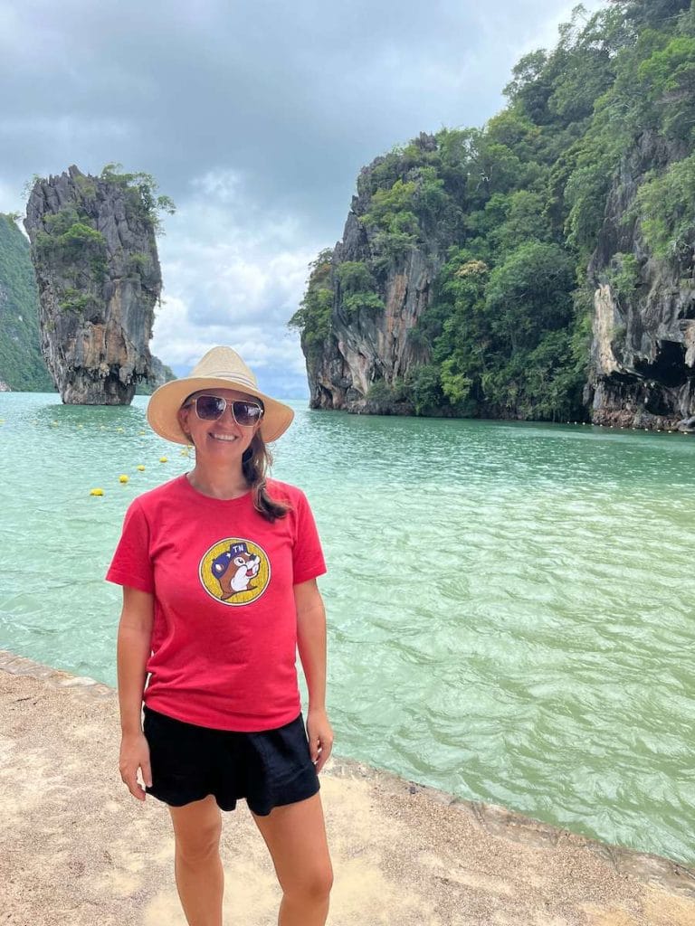 A photo of a tourist on James Bond Island in Thailand.