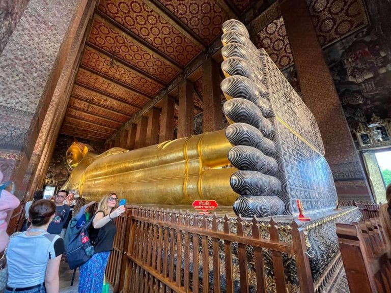 A photo inside the Temple of the Reclining Buddha in Bangkok, Thailand.