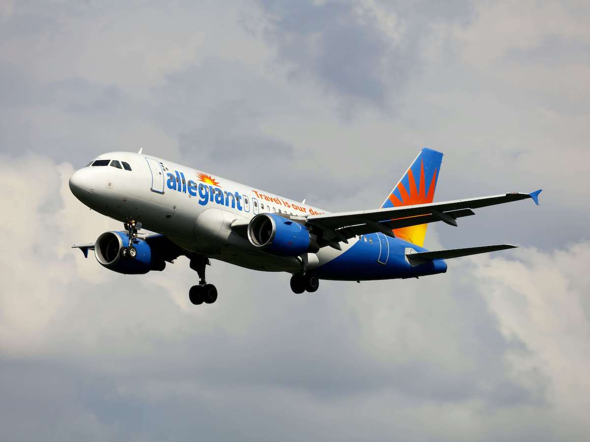 A photo of an Allegiant airplane flying