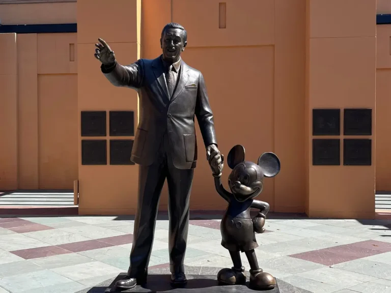 A photo of the Walt Disney and Mickey Mouse statue in Disney Legends Plaza
