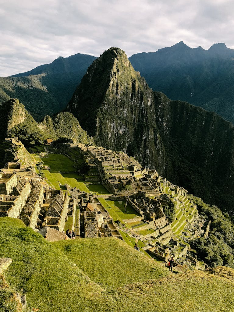A stunning aerial shot of the ancient Incan city of Machu Picchu in Peru, showcasing its historical ruins.