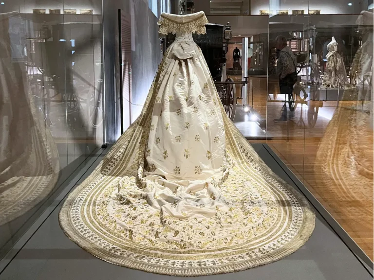 Back view of the replica of Empress Elisabeth’s wedding dress showing the embroidered train at the Imperial Carriage Museum in Vienna.