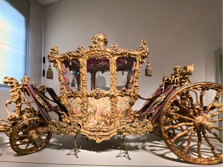 Golden coronation carriage inside the Imperial Carriage Museum at Schönbrunn Palace