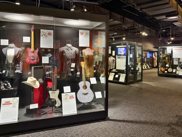 Country music memorabilia and artist displays inside the Country Music Hall of Fame in Nashville.