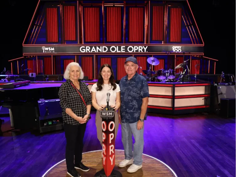 Visitors standing on the famous wooden circle during the Grand Ole Opry backstage tour