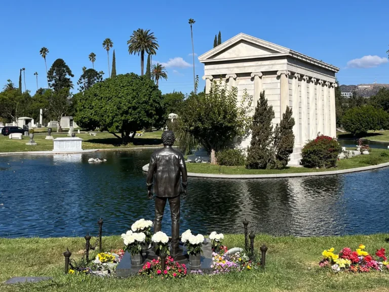 View of Hollywood Forever Cemetery with the Hollywood Sign visible in the distance.