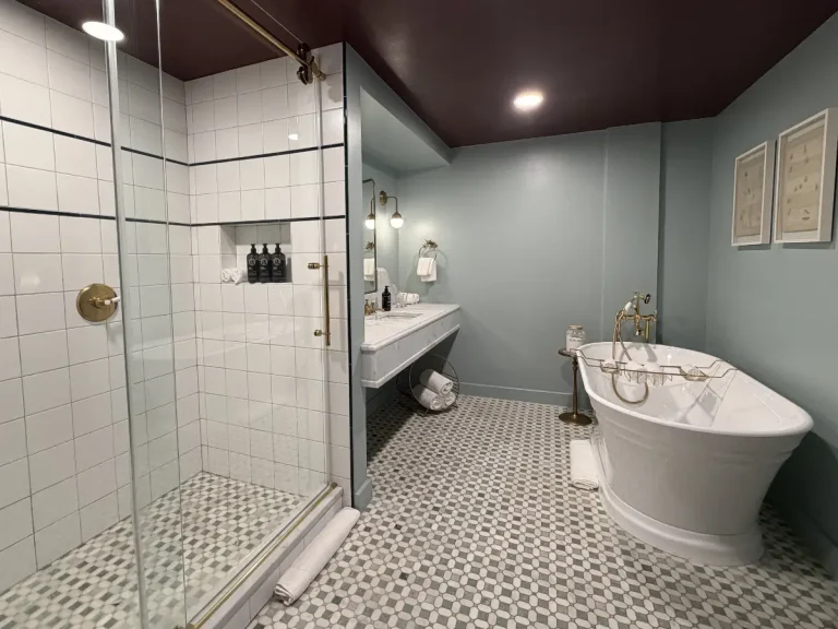 Bathroom inside the Chalet Suite at the Hotel Chalet Chattanooga Tennessee, featuring a soaking tub and separate shower.