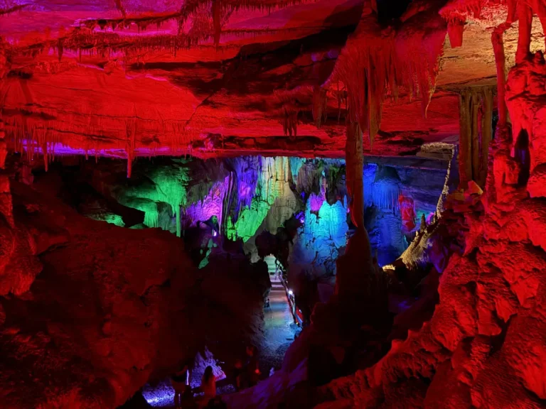 Colorful cave formations and walkway inside Raccoon Mountain Caverns during the Crystal Palace Tour in Chattanooga, Tennessee