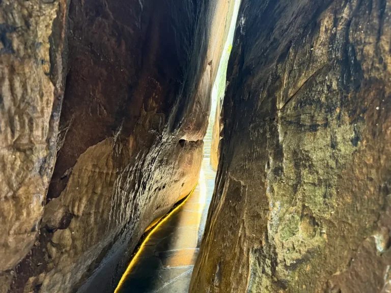 Fat Man's Squeeze at Rock City Gardens, a narrow passage between two massive rock walls on the walking trail.