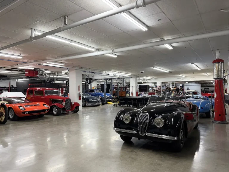 Cars in the Thomas E. and Sharon J. Malloy Family Workshop at the Petersen Automotive Museum.