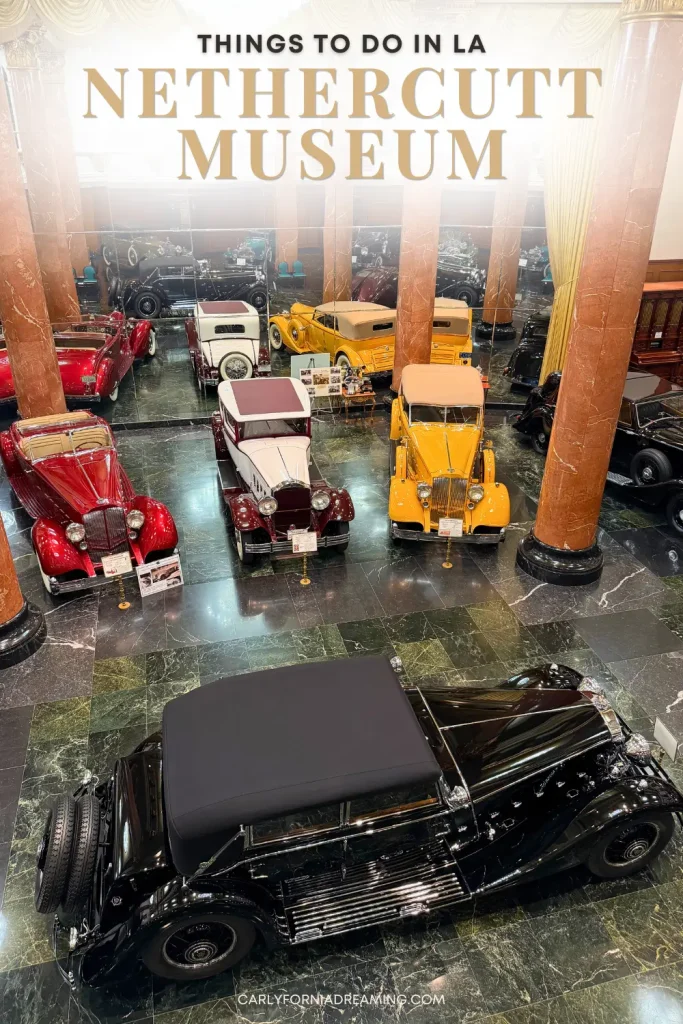 Grand Salon at the Nethercutt Museum in Los Angeles featuring dozens of vintage and classic automobiles displayed beneath marble columns.