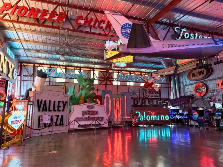 Hangar 2 at Valley Relics Museum filled with vintage San Fernando Valley neon signs.