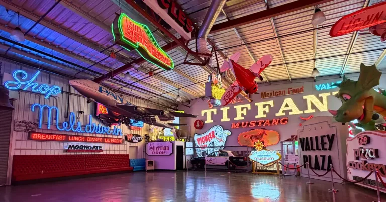 Vintage neon signs and suspended airplane inside Valley Relics Museum in Van Nuys.