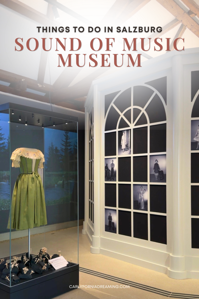 Pinterest pin featuring an interior exhibit at the Sound of Music Museum in Salzburg, Austria, with Liesl's dress on display and a wall of historical photographs.